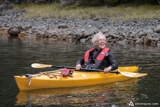 Happy woman on a kayaking tour