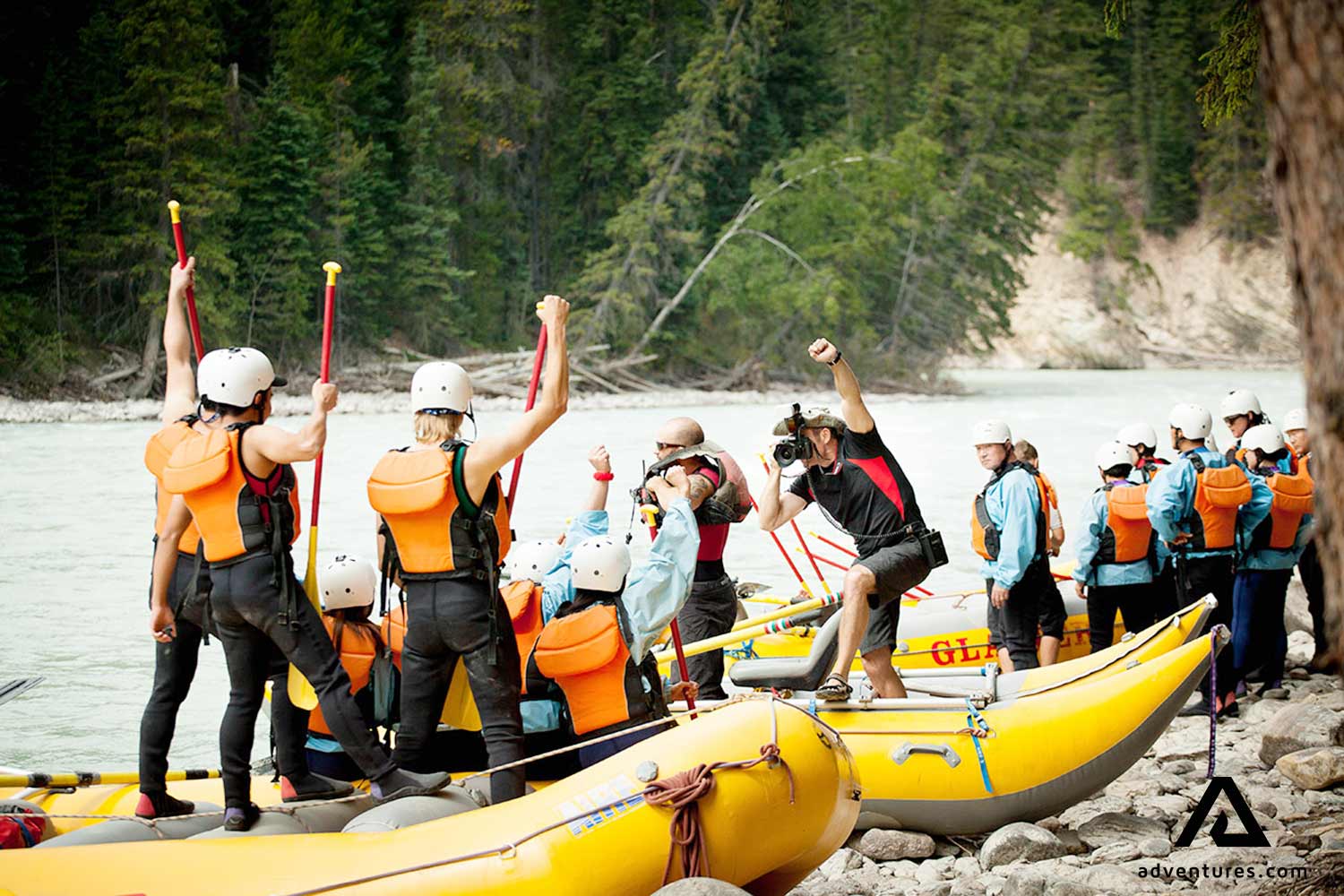 happy group finished rafting on a shore