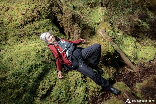 Woman laying on a moss