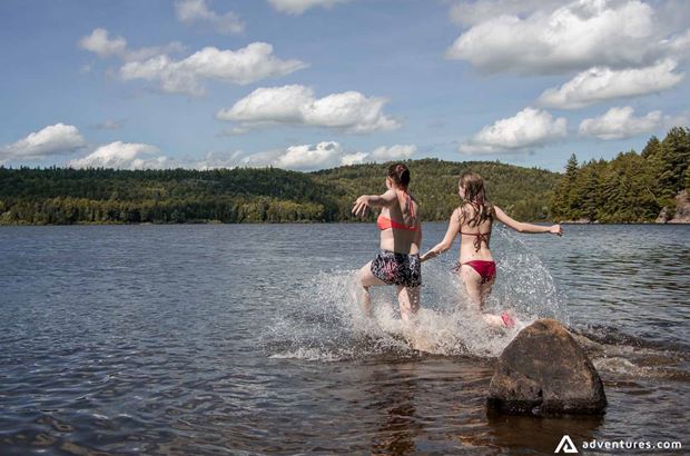 running into a lake girls running into a lake
