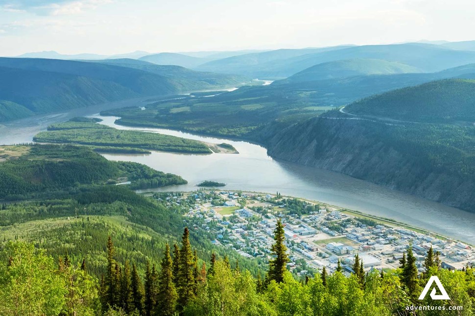 aerial view of dawson city between rivers