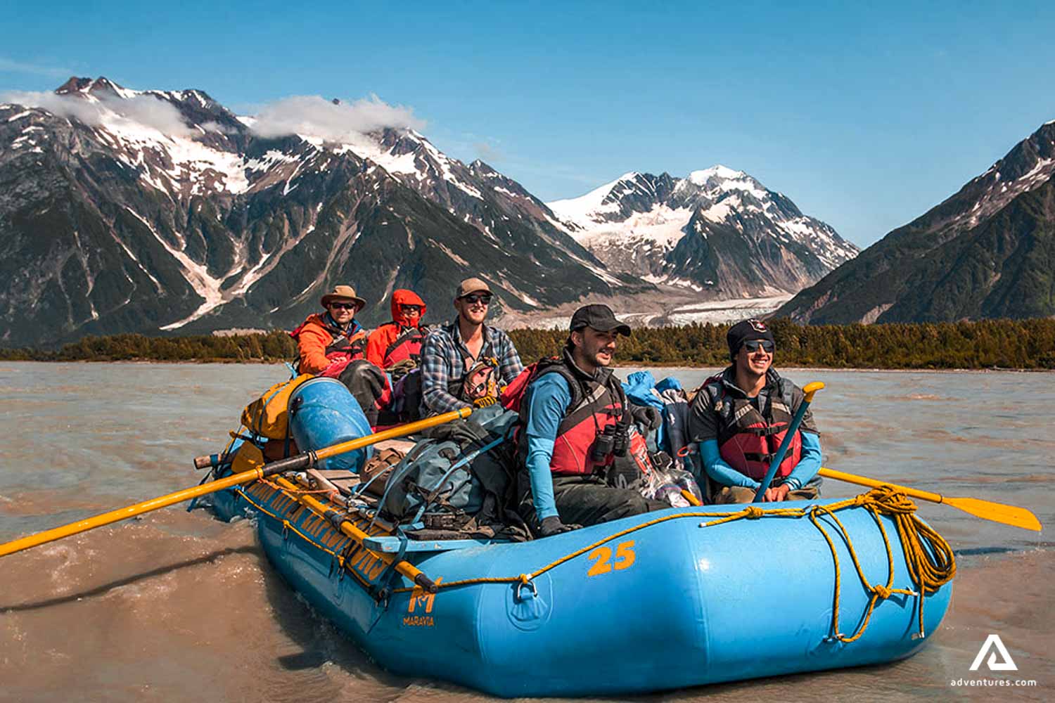 happy group in a raft posing for a picture