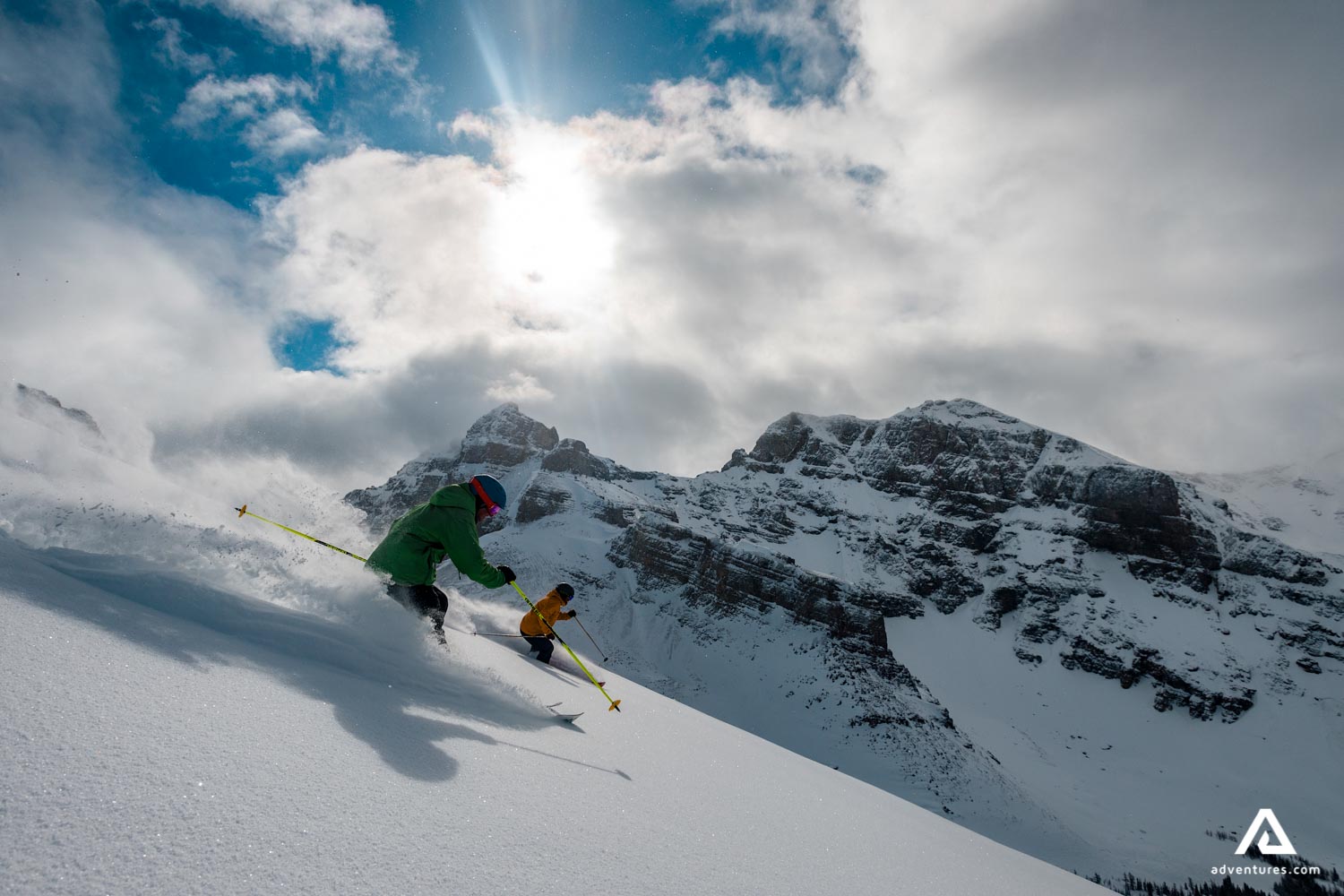 two fast skiers in the mountains