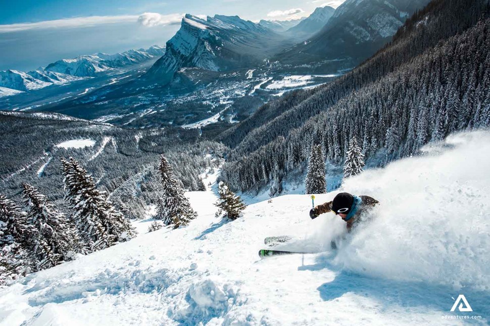 skier going down a mountain fast skiing