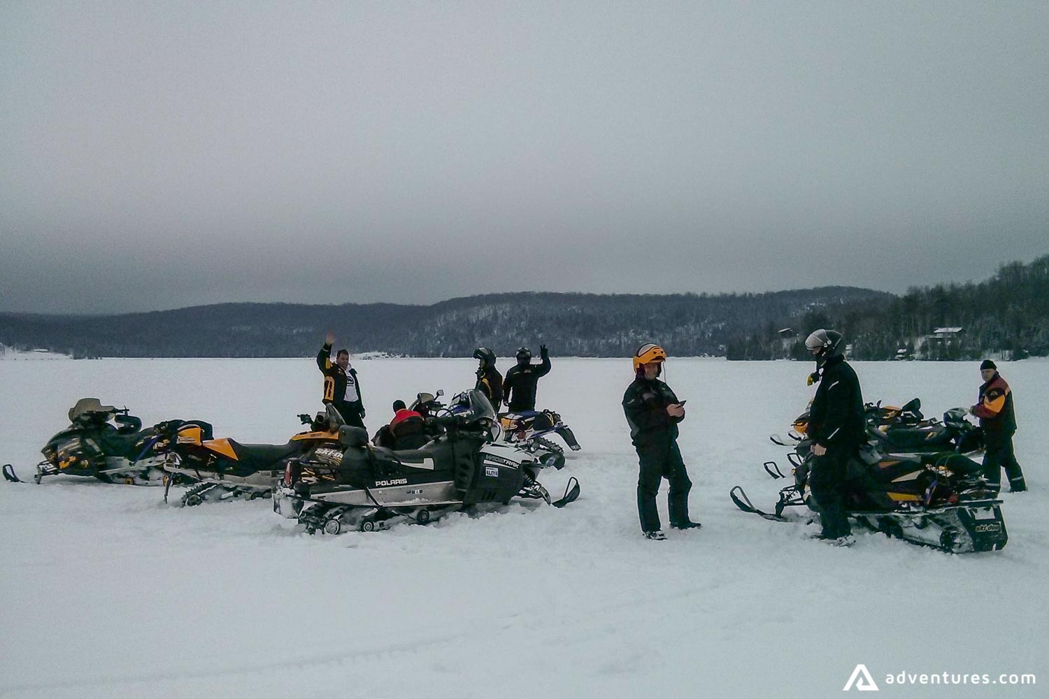 smowmobiling on a snowy field in canada