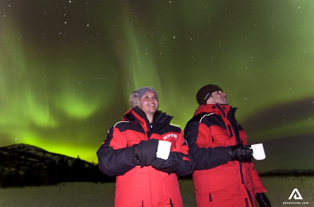 drinking hot chocolate and watching aurora borealis in canada