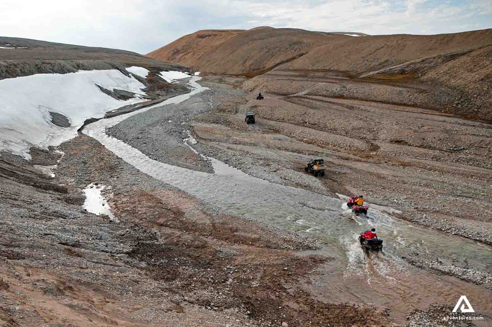 crossing a river with atvs in nunavut