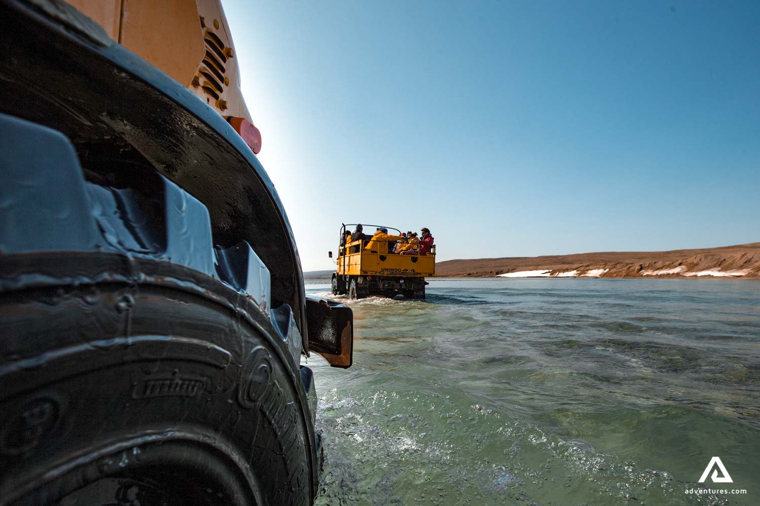 crossing a river with a super truck in nunavut