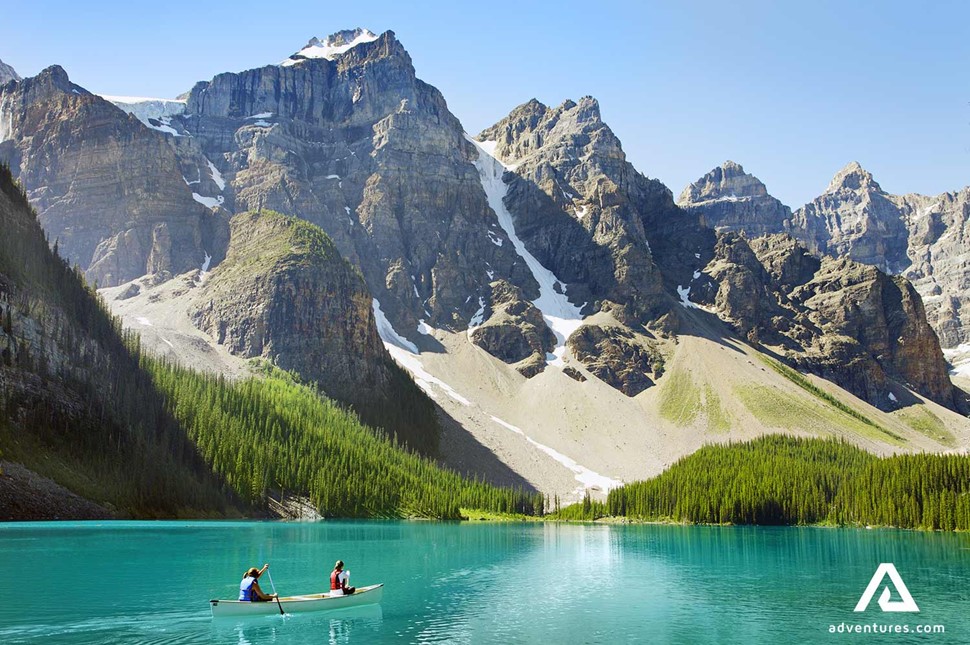 canoeing in lake moraine in canada at summer