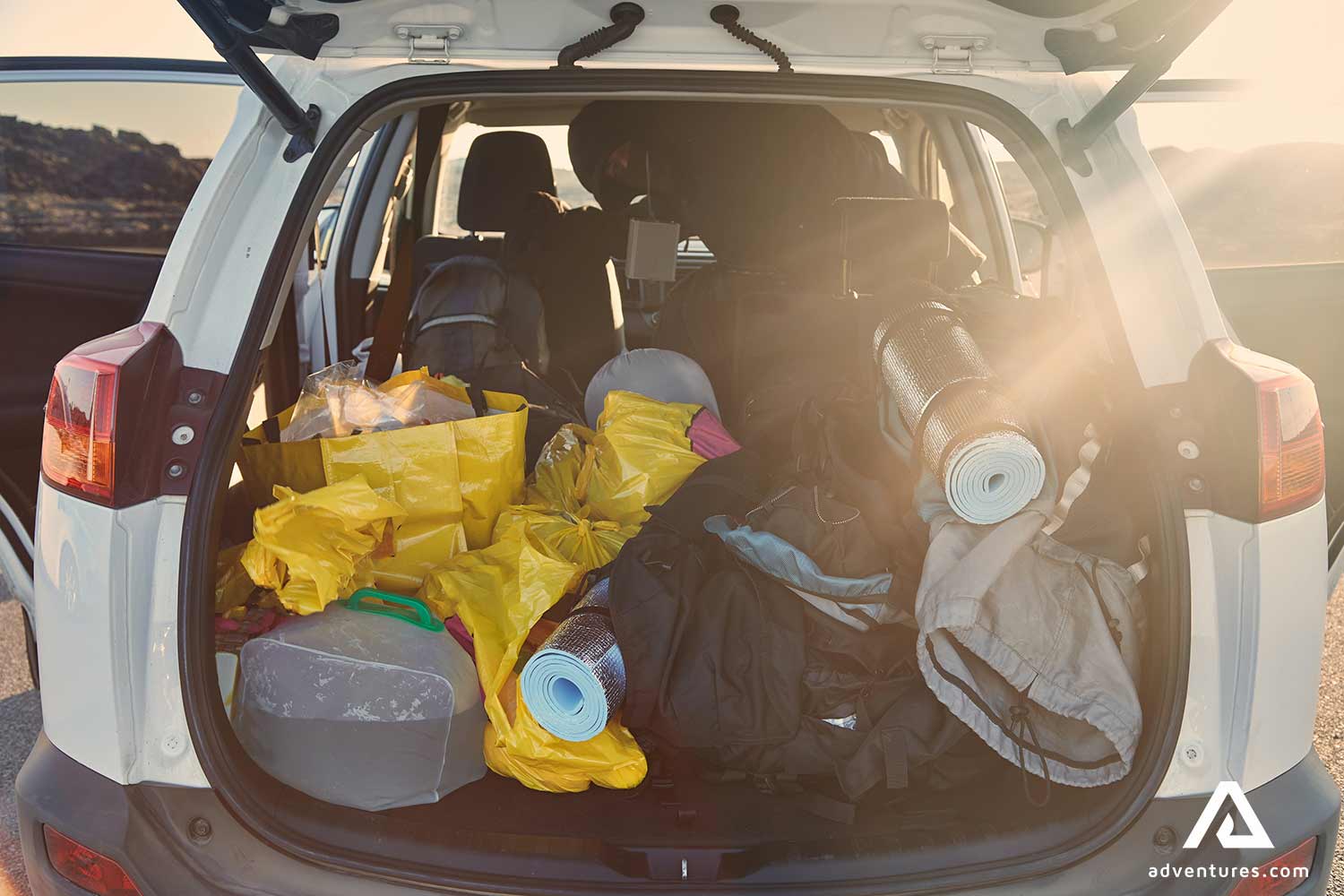 car trunk full of equipment for travelling