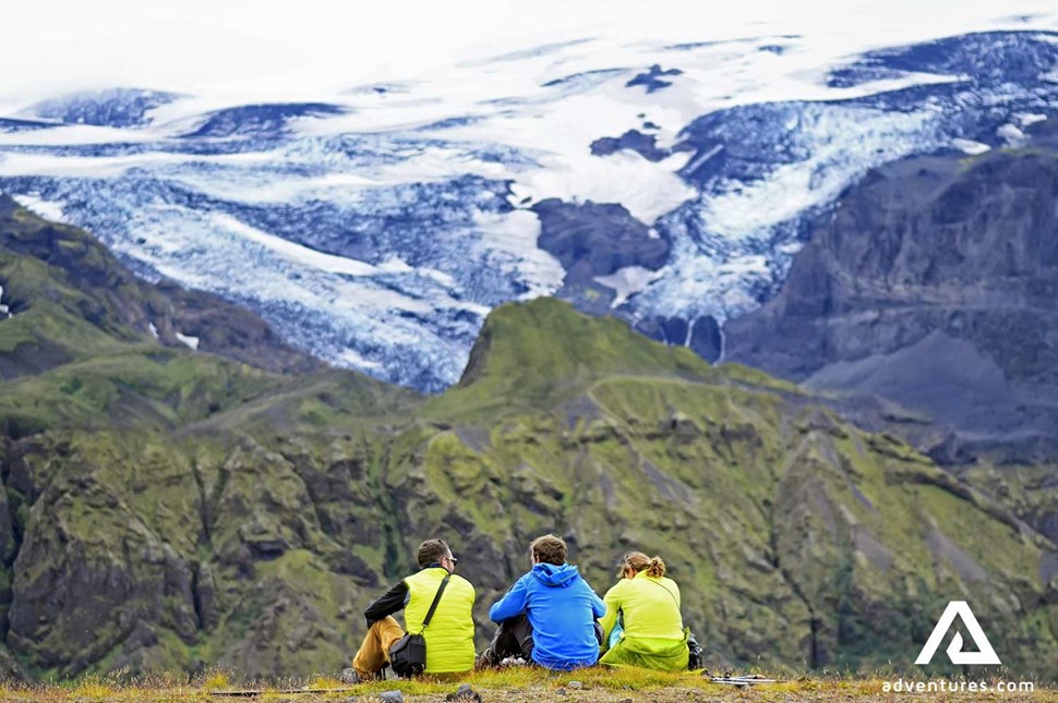 friends resting and enjoying the mountain view in iceland