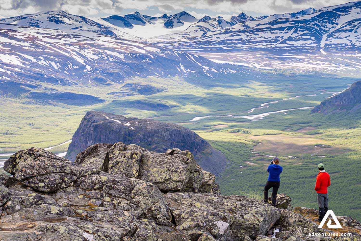 hikers near the top of mount skierfe in sweden