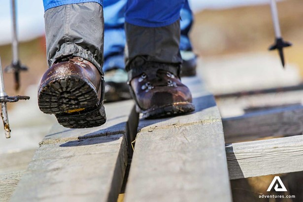 sturdy hiking boots on a wooden bridge in sweden