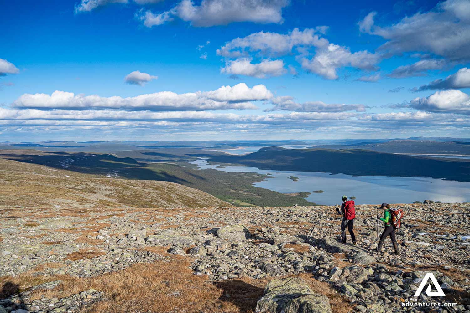 hikers walking near a mountain ridge in sweden
