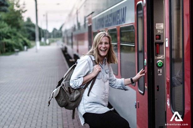 woman boarding a train in lithuania