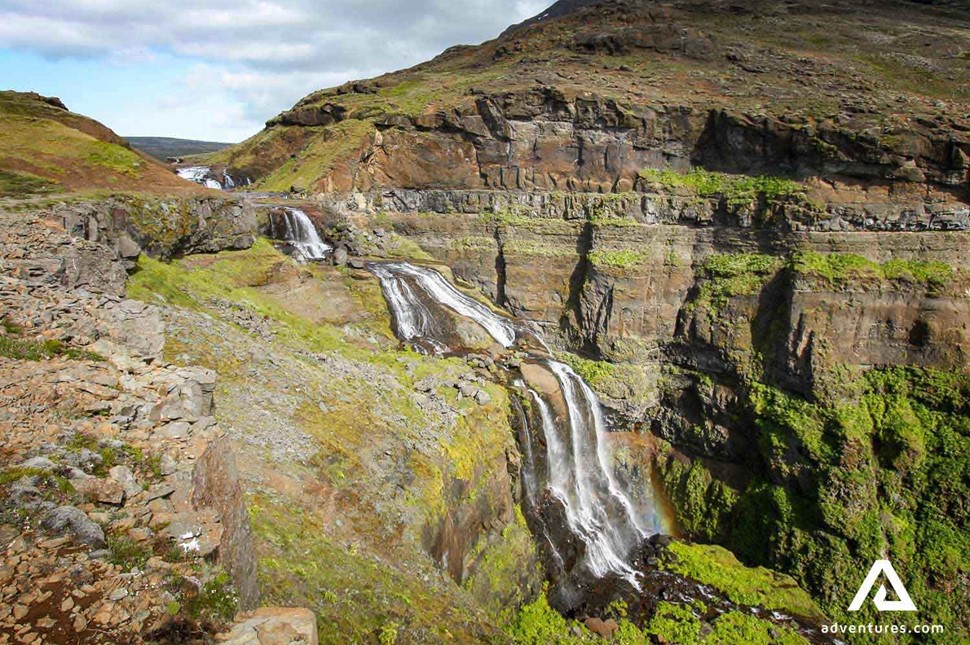 a view of glymur waterfall from the top hiking side