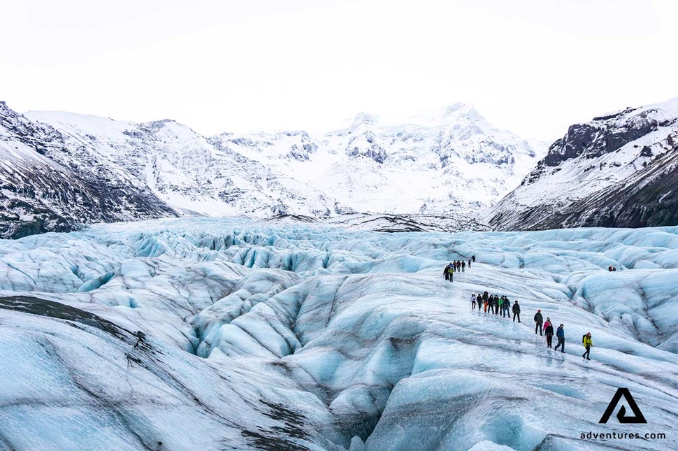 two groups hiking on svinafellsjokull glacier