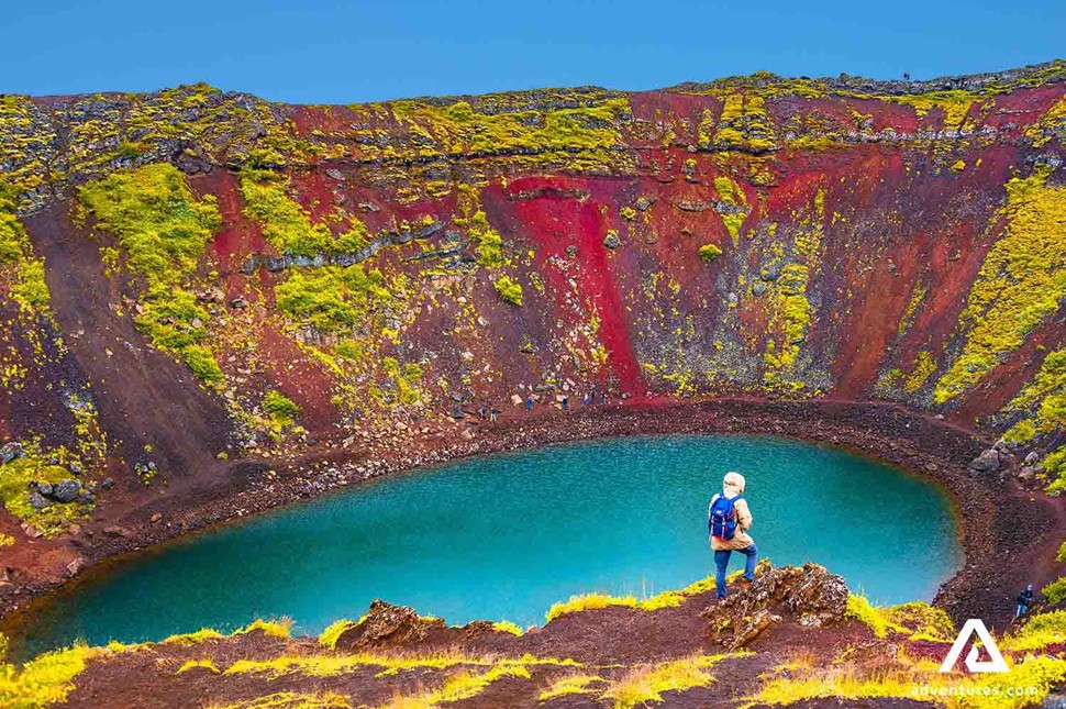 standing and watching kerid crater in iceland
