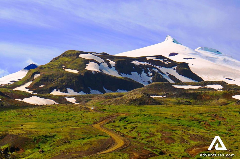 gravel road leading to snaefelljokull glacier in iceland