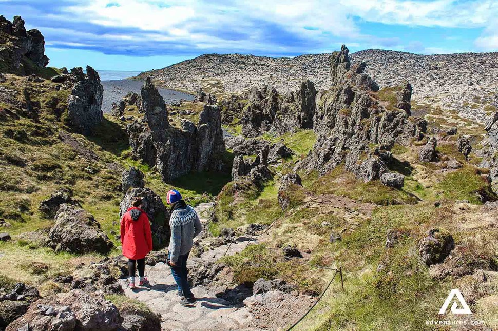 walking around lava rock formations in snaefellsnes