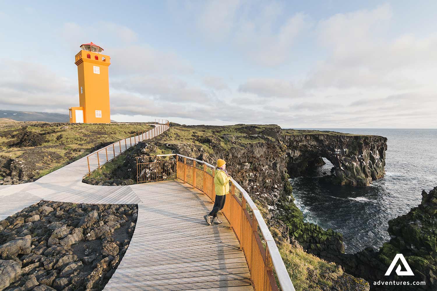orange lighthouse in snaefellsnes in iceland