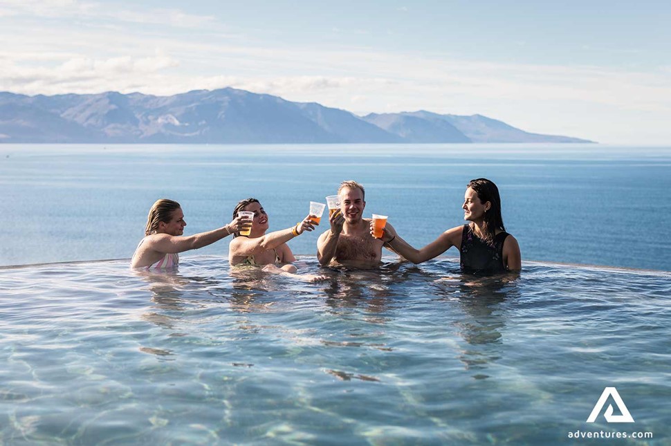 friends celebrating in geosea hot spring pool