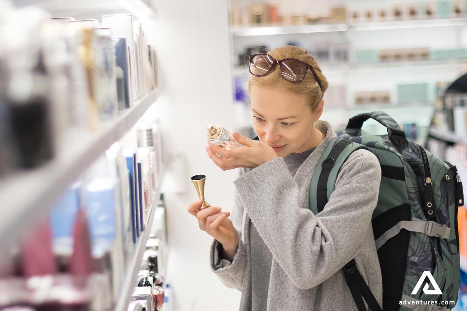 woman shopping for parfume in a shop