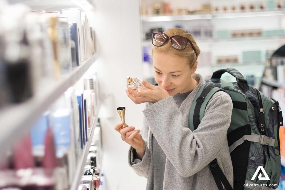 woman shopping for parfume in a shop