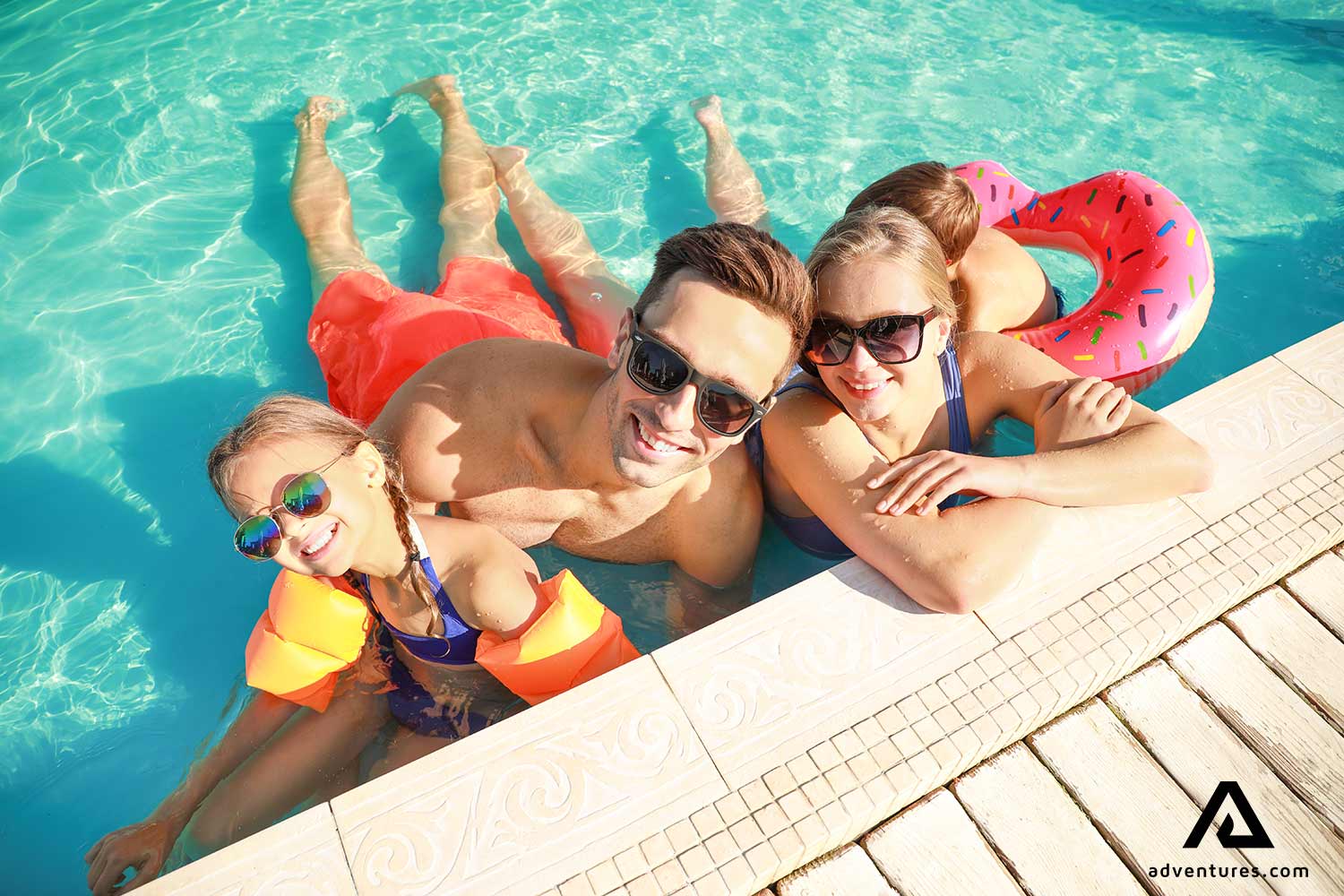happy family in a swimming pool in iceland