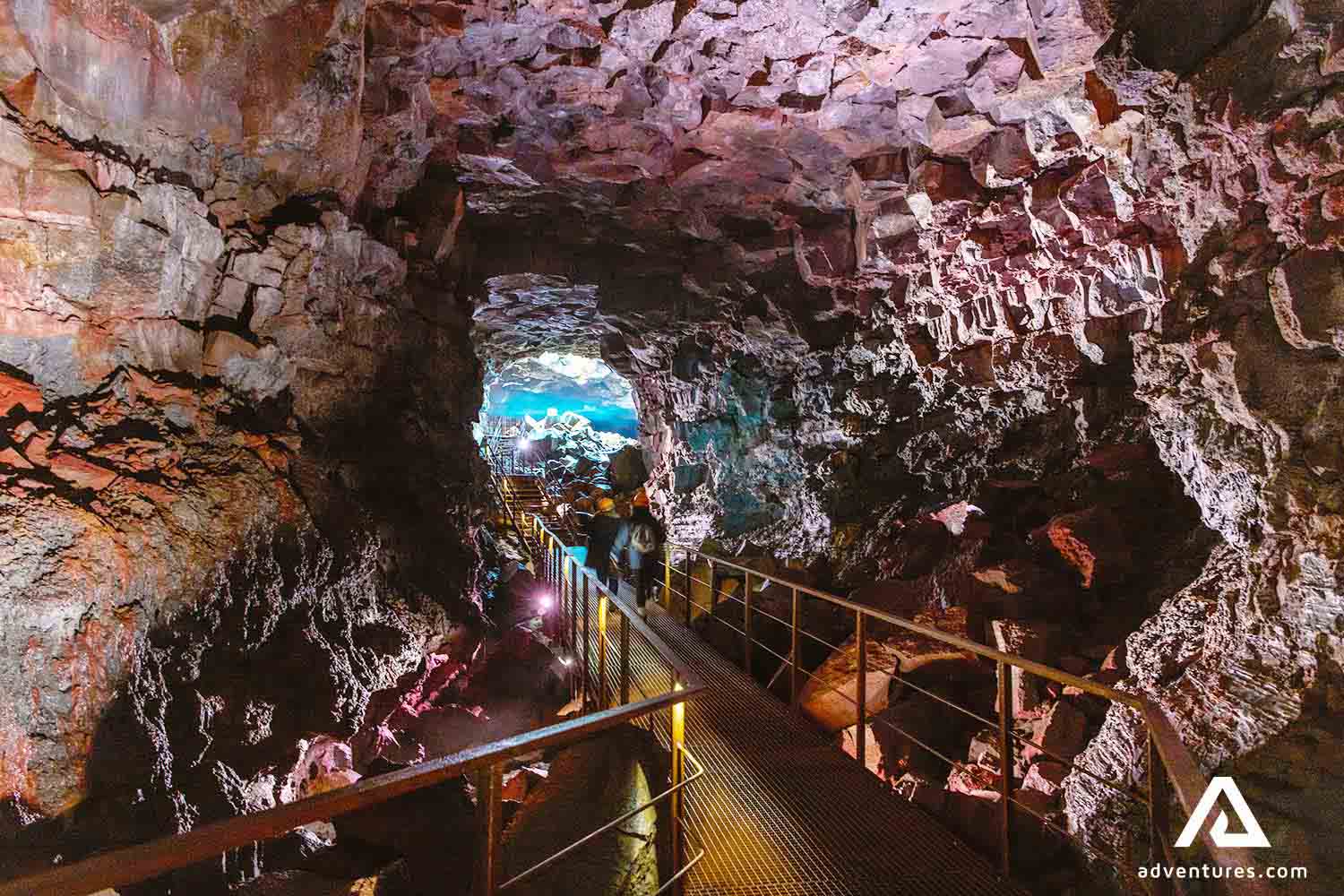 steel walking path bridge inside a lava tunnel in iceland