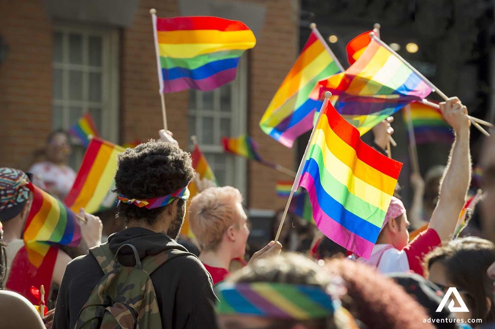 people cheering on gay pride walk parade