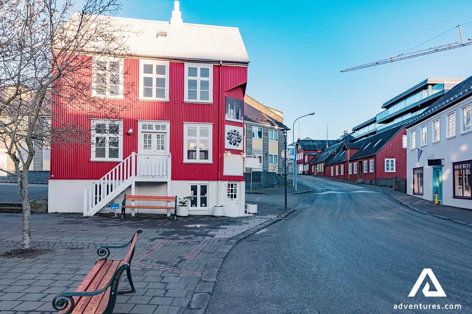 red house in a street in reykjavik in iceland