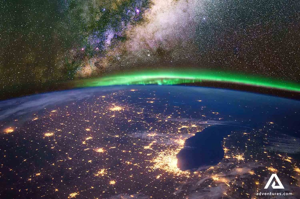 outer space view of earth and northern lights 