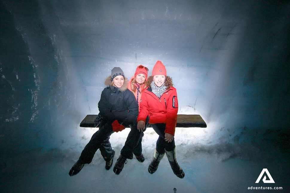 three friends in an ice cave on langjokull