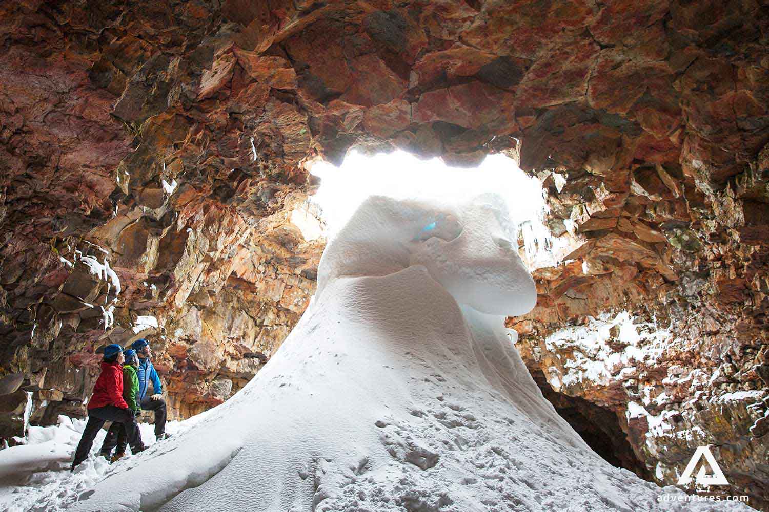 snow inside lava tunnel in iceland