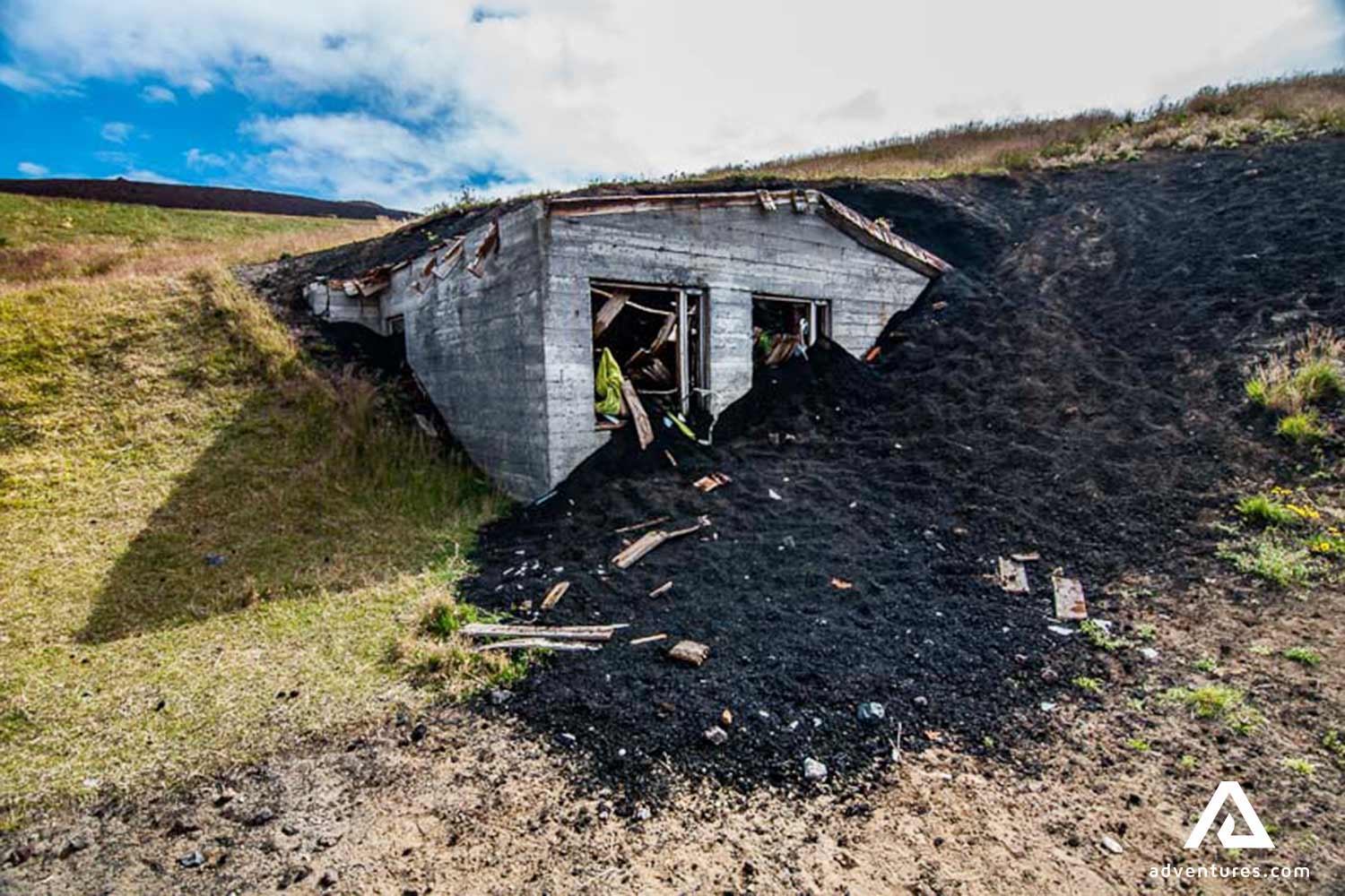 house aburried in volcanic ash ice westman islands