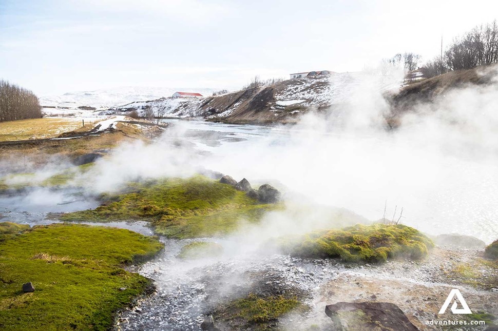 steaming geothermal secret lagoon area in iceland