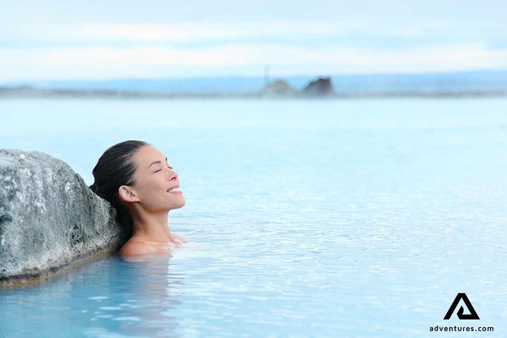 happy woman enjoying the blue lagoon