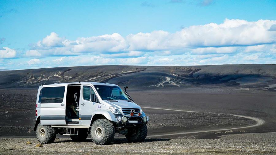 super jeep near a volcanic ash gravel road