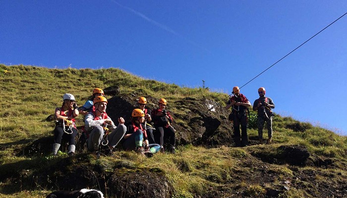 group getting ready for zipline tour in Vik