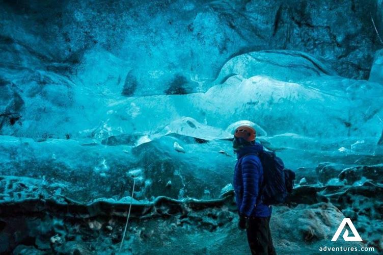 inside crystal ice cave a man inside crystal ice cave