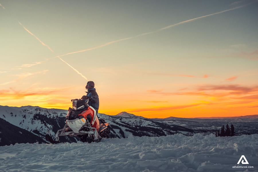 Snowmobiling at sunset
