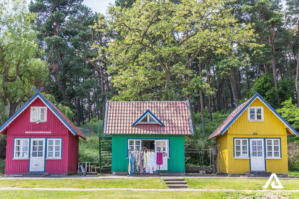 three wooden colorful houses