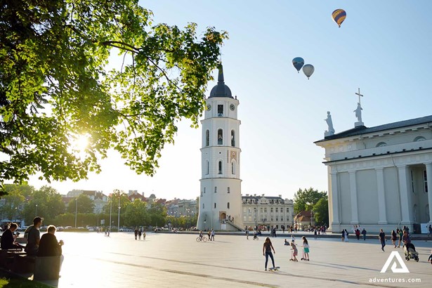 hot air balloons above vilnius cathedral square in summer