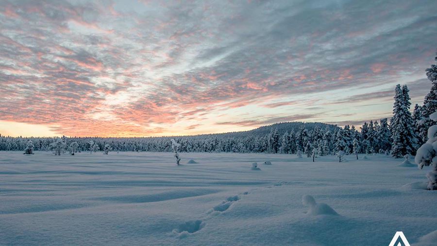 sunset near a frozen winter lake