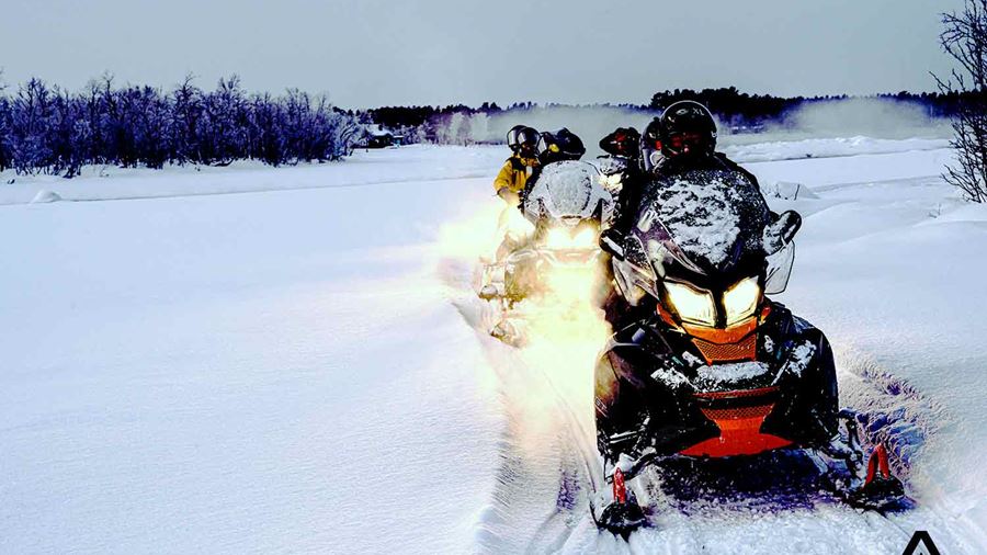 small group snowmobiling