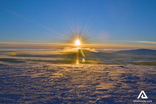 winter sunset above clouds in lapland