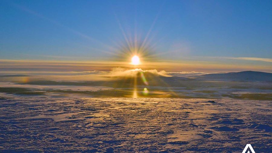 winter sunset above clouds