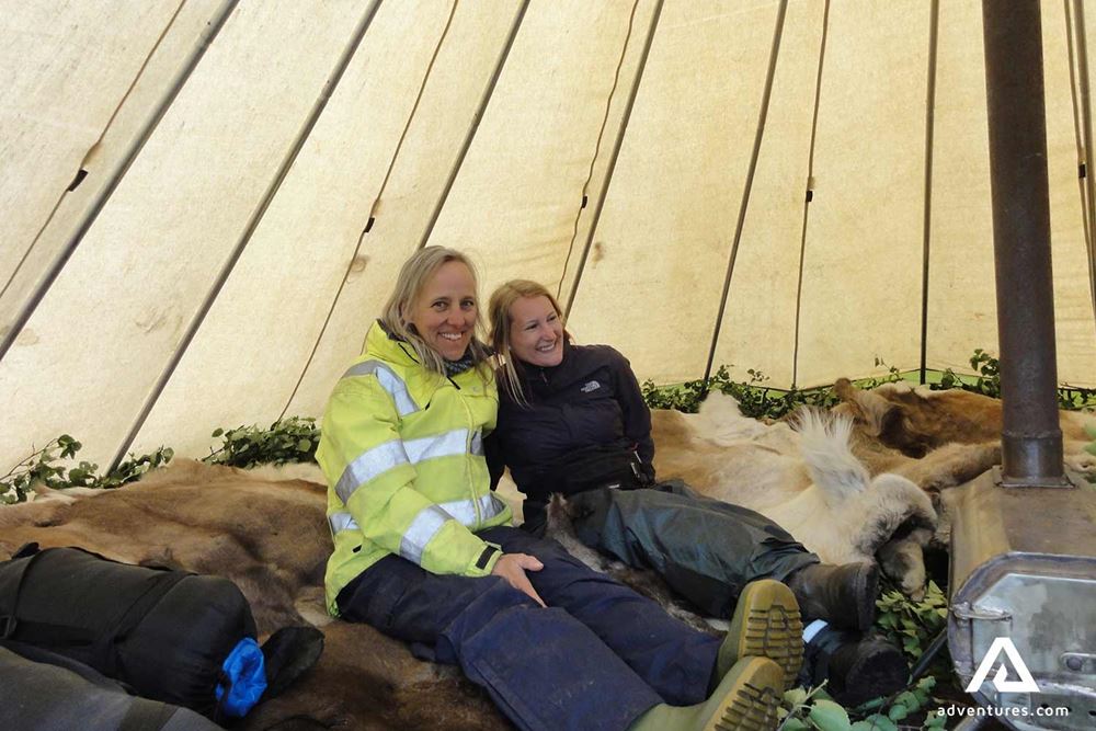 two happy woman in a tent