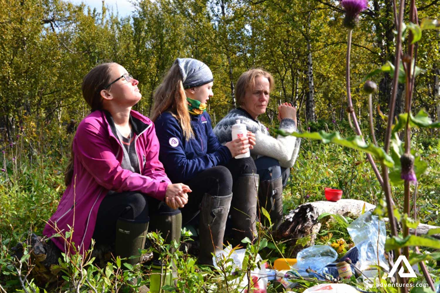 happy friends resting in summer in sweden